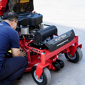 stand-on-mower-maintenance-technician-inspecting-deck-engine.jpg stand-on-mower-maintenance-technician-inspecting-deck-engine.jpg